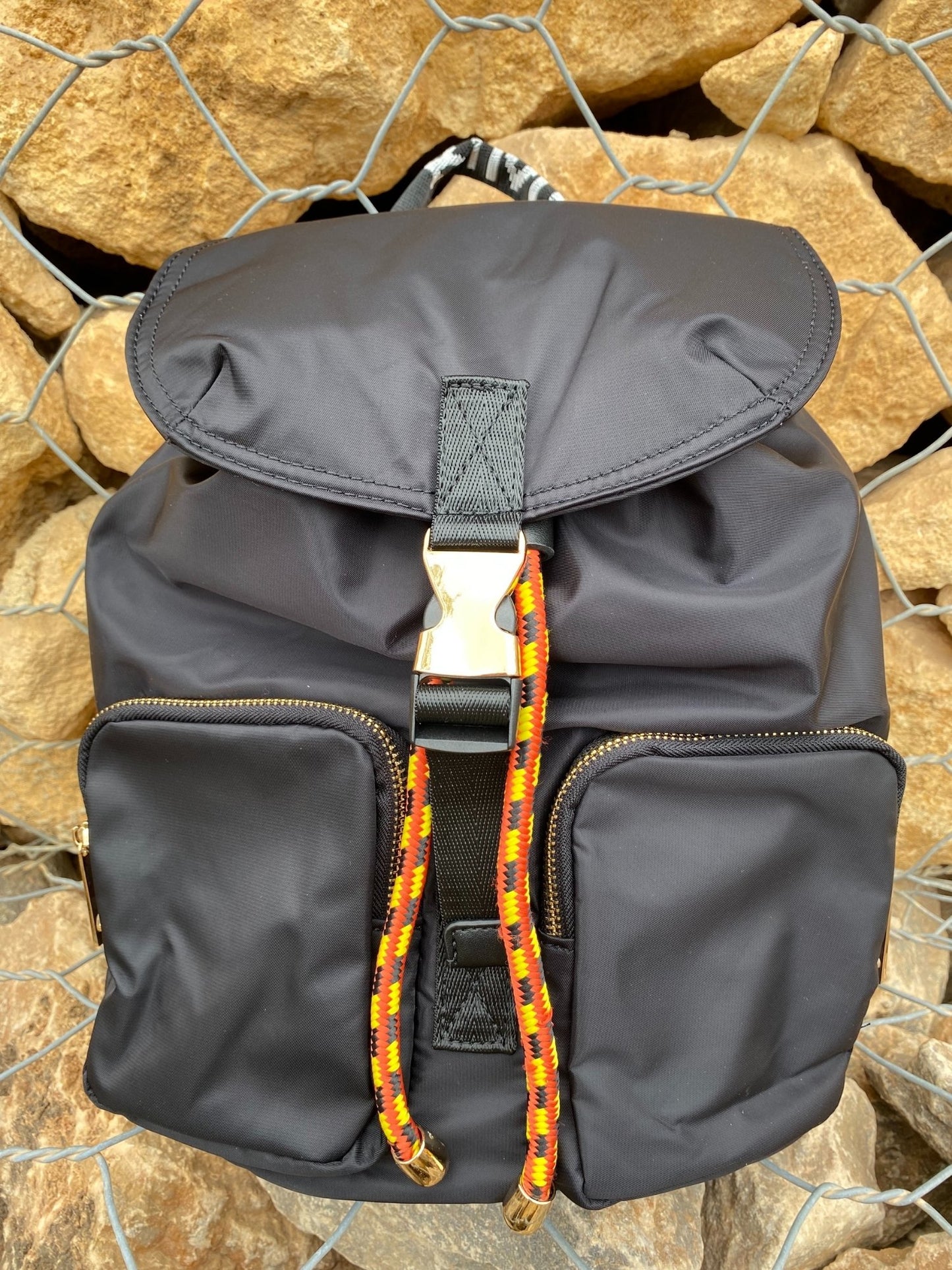 Belted Blue Backpack with Adjustable Straps and Gold Accents