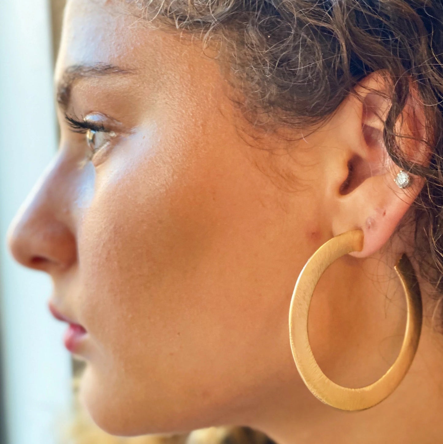 Alma Thick Flattened Metal Hoop Earrings in Gold 2.25 Inch