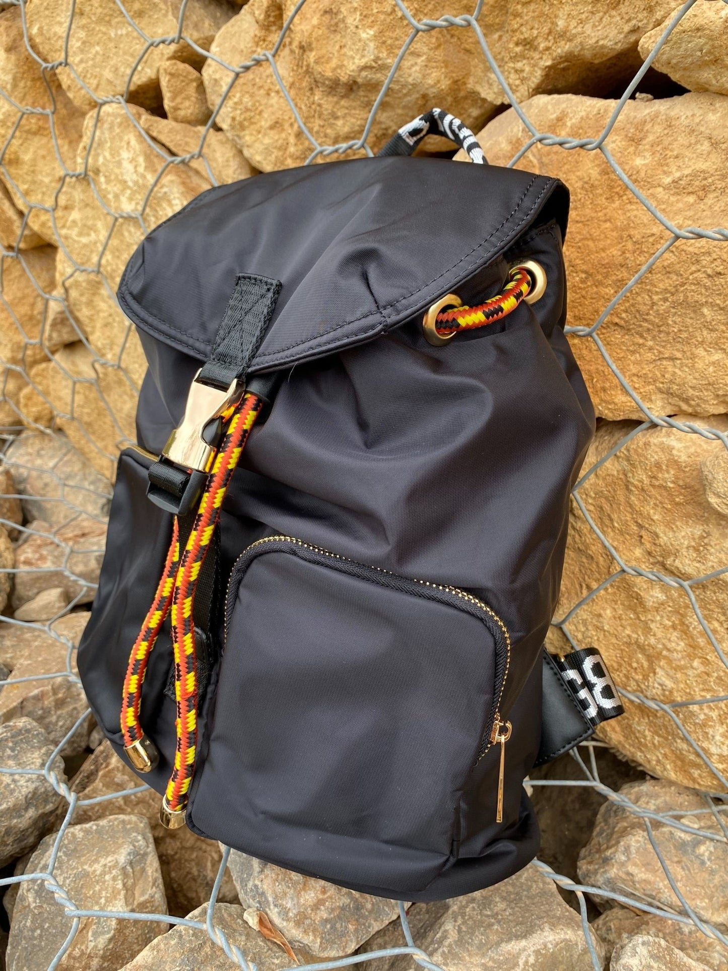 Belted Blue Backpack with Adjustable Straps and Gold Accents