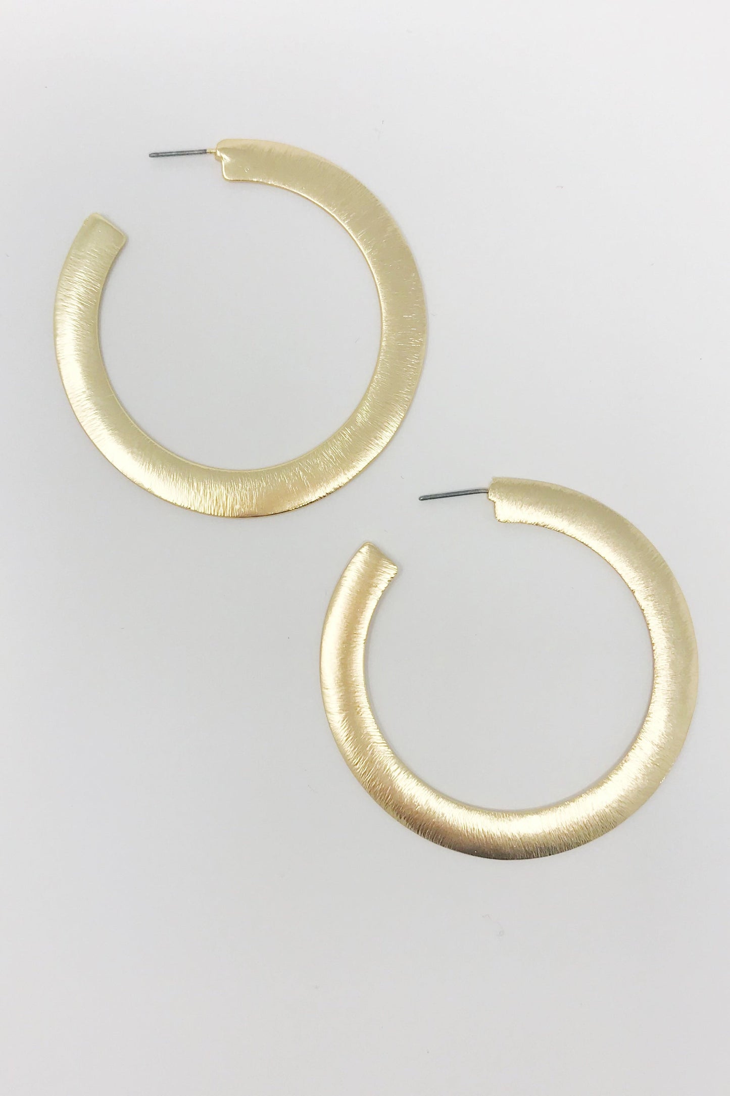 Alma Thick Flattened Metal Hoop Earrings in Gold 2.25 Inch