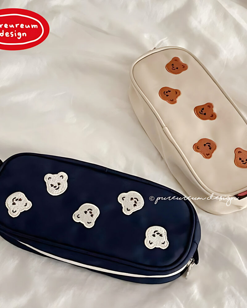 "meta_description": "Cupid Bear Embroidered Pencil Pouch - Cute & practical storage for your stationery needs.",